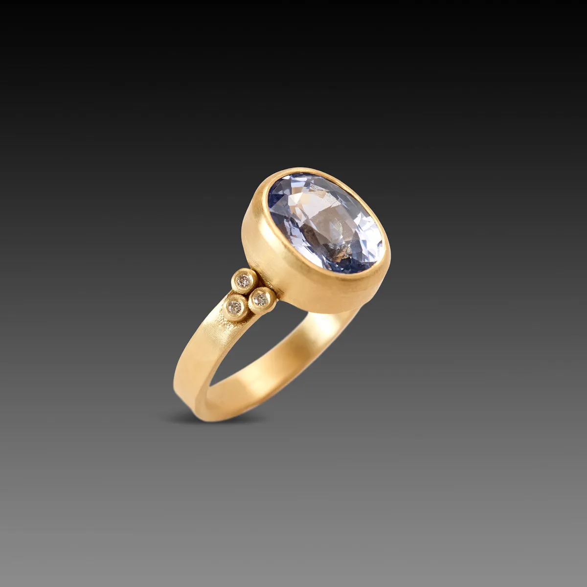 Oval Sapphire Ring with Diamond Trios